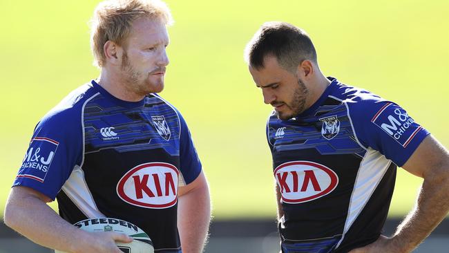 Reynolds chats with James Graham at training. Photo: Brett Costello