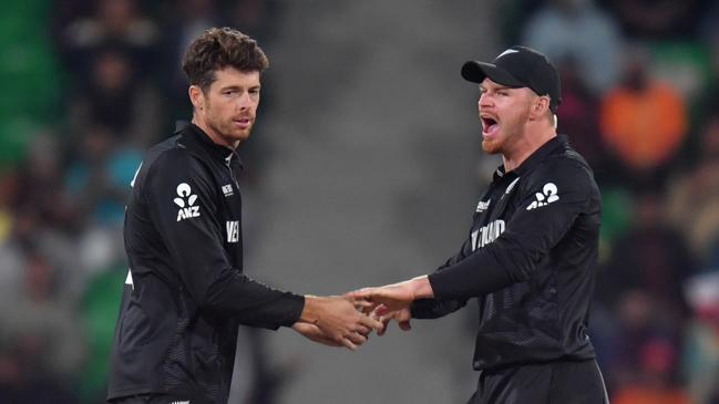 Mitchell Santner (left) with Glenn Phillips (right) after a wicket. Photo by Sameer Ali/Getty Images.