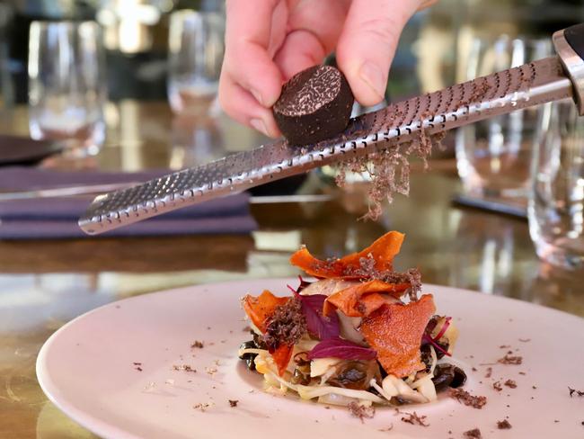 Shaving truffle over goose liver parfait. Picture: Jenifer Jagielski