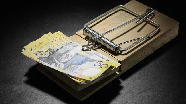 Australian dollars in a mousetrap. money, generic $50 notes