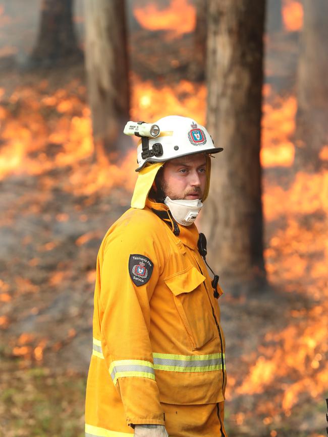 TFS firefighters put in a controlled fire break behind a home on Donnellys Road Geeveston. Picture: NIKKI DAVIS-JONES