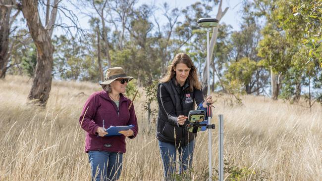 Karen Johnson and University of Tasmania conservation and planning researcher and Associate Professor Vanessa Adams. Prof Adams has contributed to an alarming new report. Scientists are worried climate change is becoming an increasing risk to endemic plants. Photo: UTAS/Peter W. Allen