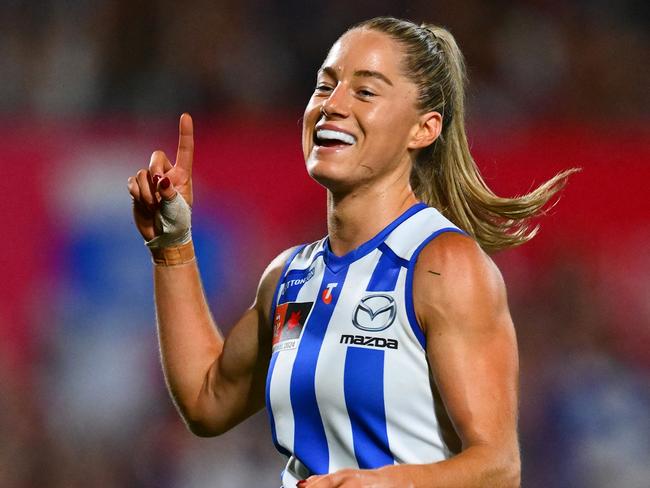 MELBOURNE, AUSTRALIA - NOVEMBER 30: Alice O'Loughlin of the Kangaroos celebrates kicking a goal during the AFLW Grand Final match between North Melbourne Tasmanian Kangaroos and Brisbane Lions at Ikon Park, on November 30, 2024, in Melbourne, Australia. (Photo by Quinn Rooney/Getty Images)