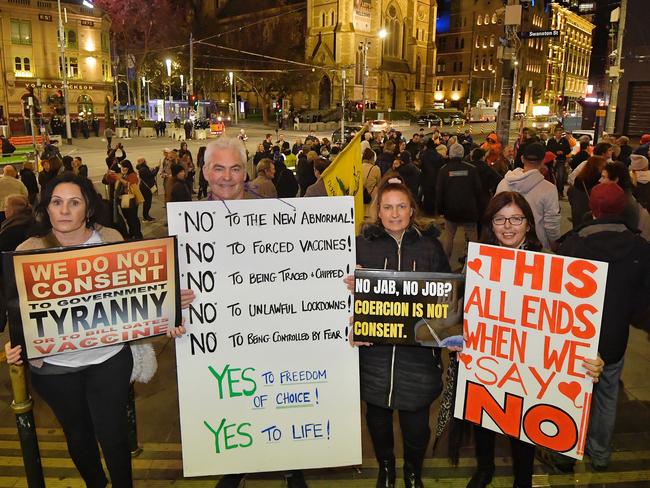 Protesters gather at Flinders Street Station to protest the 7 day Covid 19 lockdown. Picture: Jason Edwards