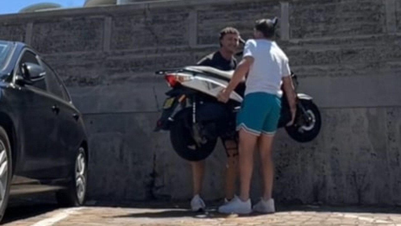 Two men have filmed themselves moving a moped from a parking spot at Bondi Beach. Picture: TikTok