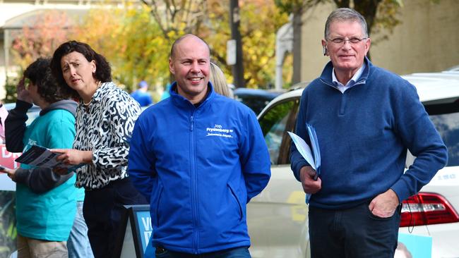 Treasurer John Frydenberg with former Victorian premier Ted Baillieu at the pre-polling station in Hawthorn on Monday. Picture: NCA NewsWire / Nicki Connolly