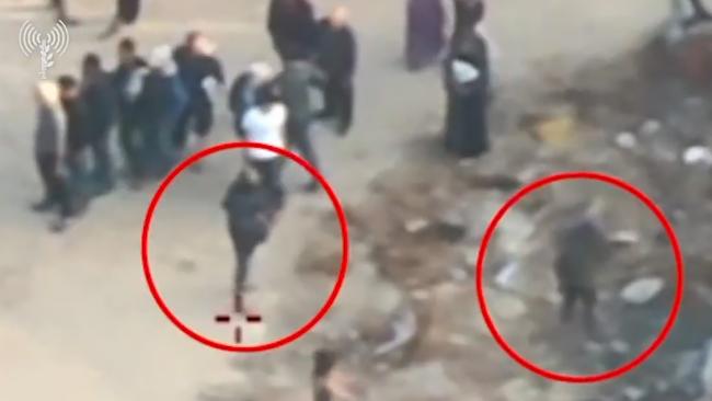 An IDF-published drone video claims to show Palestinian gunmen and other masked Palestinians opening fire and throwing stones at Gazans heading to collect humanitarian aid