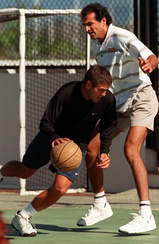 George Clooney on the basketball court at the Sheraton Mirage with Julien Petit.