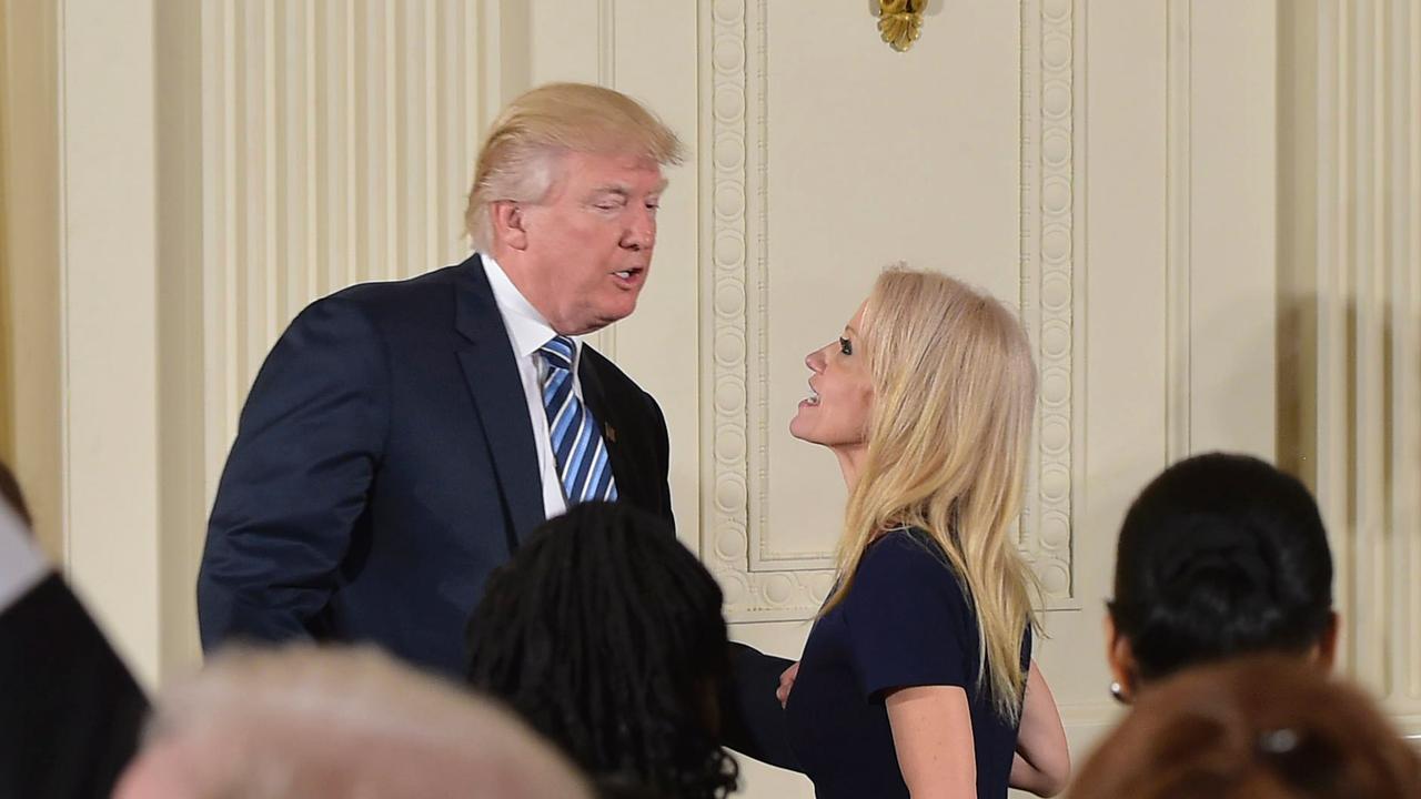 US President Trump speaks with Conway after the swearing in of the White House senior staff. Picture: AFP