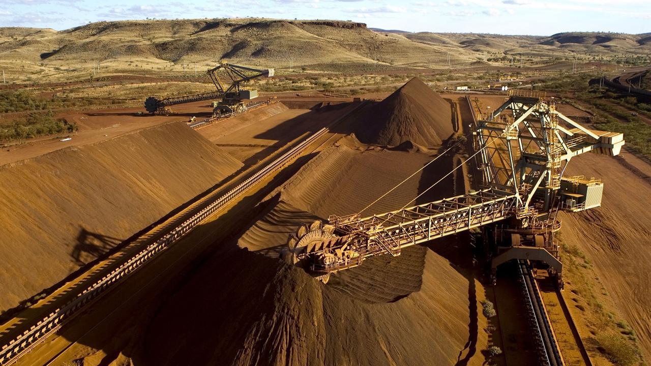 Lower commodity prices sliced Rio Tinto’s annual profit 41 per cent to $US12.4bn ($18.2bn). Iron ore represents nearly 70 per cent of underlying earnings. Picture: AFP/Rio Tinto