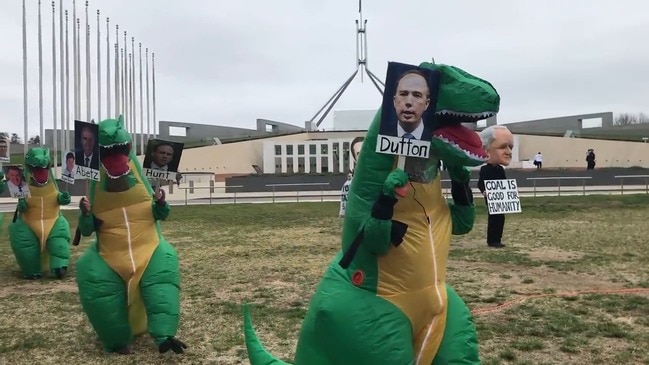 RAW: Coal protesters don dinosaur costumes outside parliament