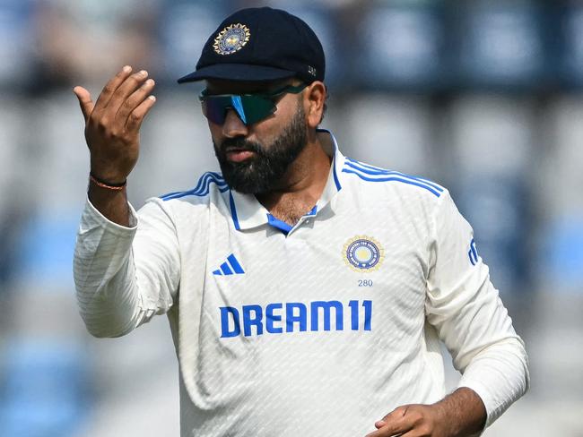 India's captain Rohit Sharma arranges the field during the second day of the third and final Test cricket match between India and New Zealand at Wankhede Stadium in Mumbai on November 2, 2024. (Photo by INDRANIL MUKHERJEE / AFP) / -- IMAGE RESTRICTED TO EDITORIAL USE - STRICTLY NO COMMERCIAL USE --