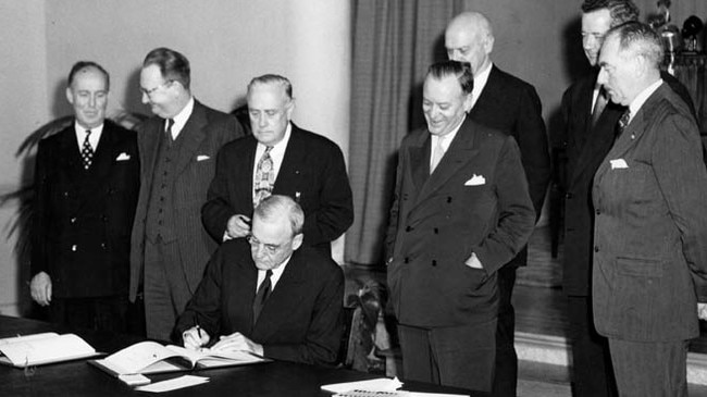 US politicians and diplomats watch as US State Department adviser John Foster Dulles signs the ANZUS Treaty in San Francisco in 1951.