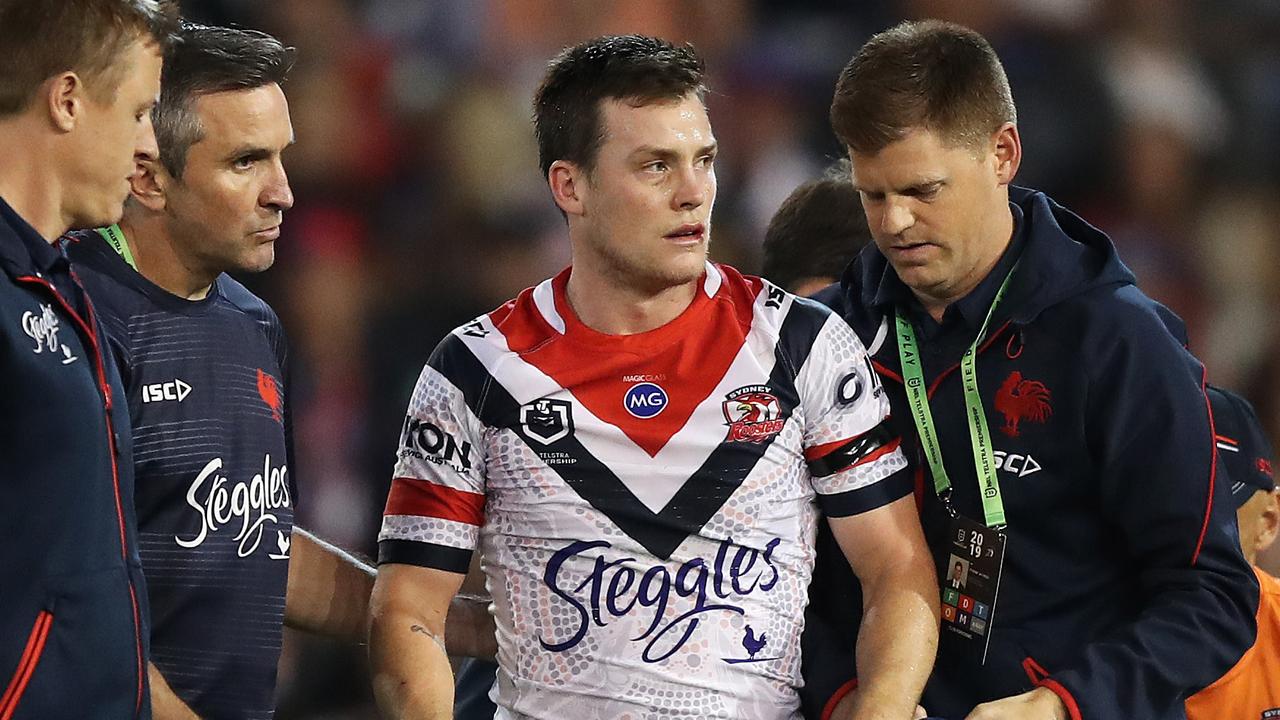 Roosters Luke Keary leaves the field after a head knock. Picture: Brett Costello