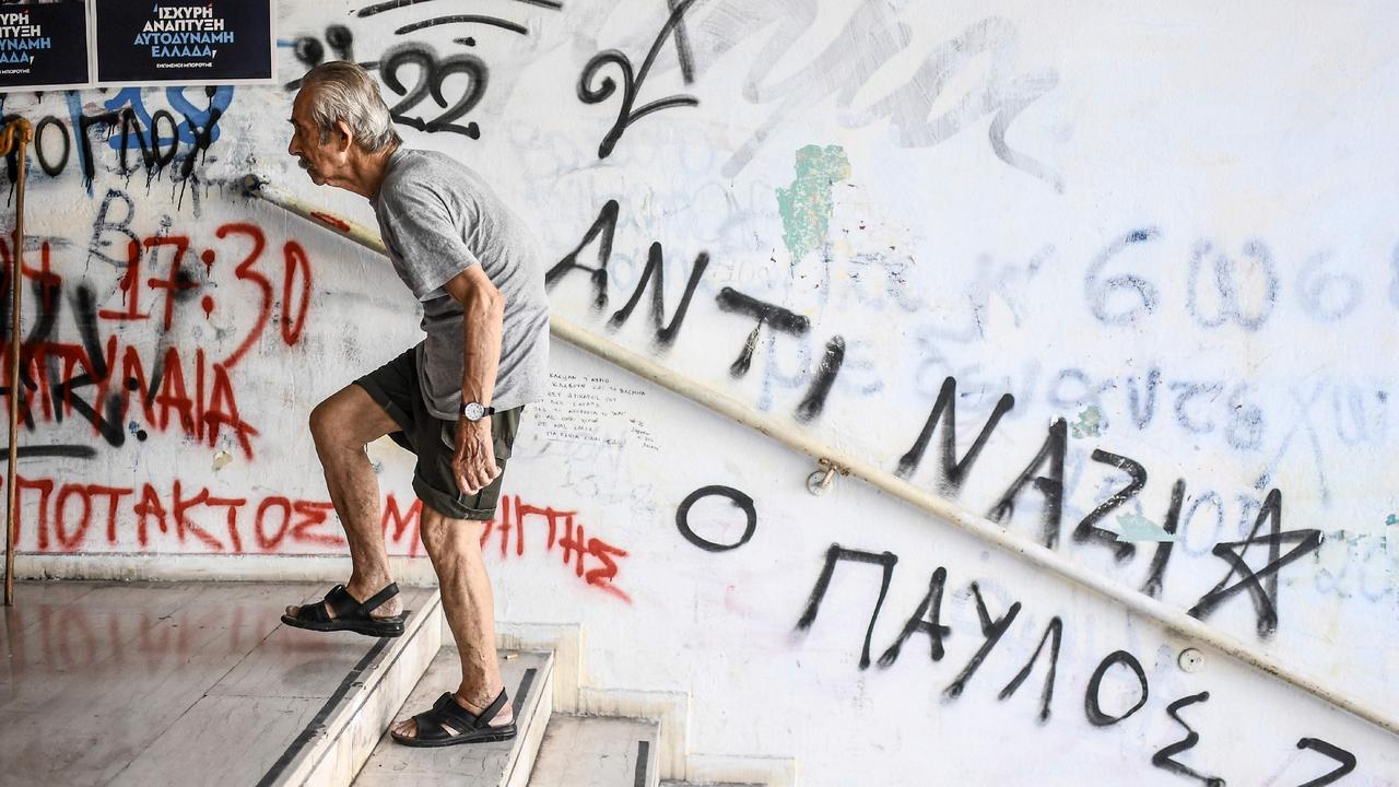 An elderly man arrives at a polling station to vote during Greek general elections in Athens. Picture: AFP