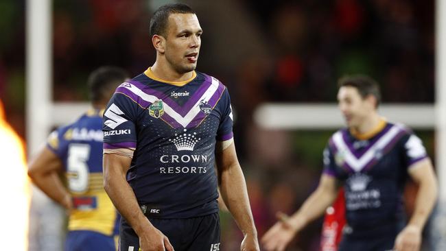 Mitchell faces off with Storm centre Will Chambers. (AAP Image/Daniel Pockett)