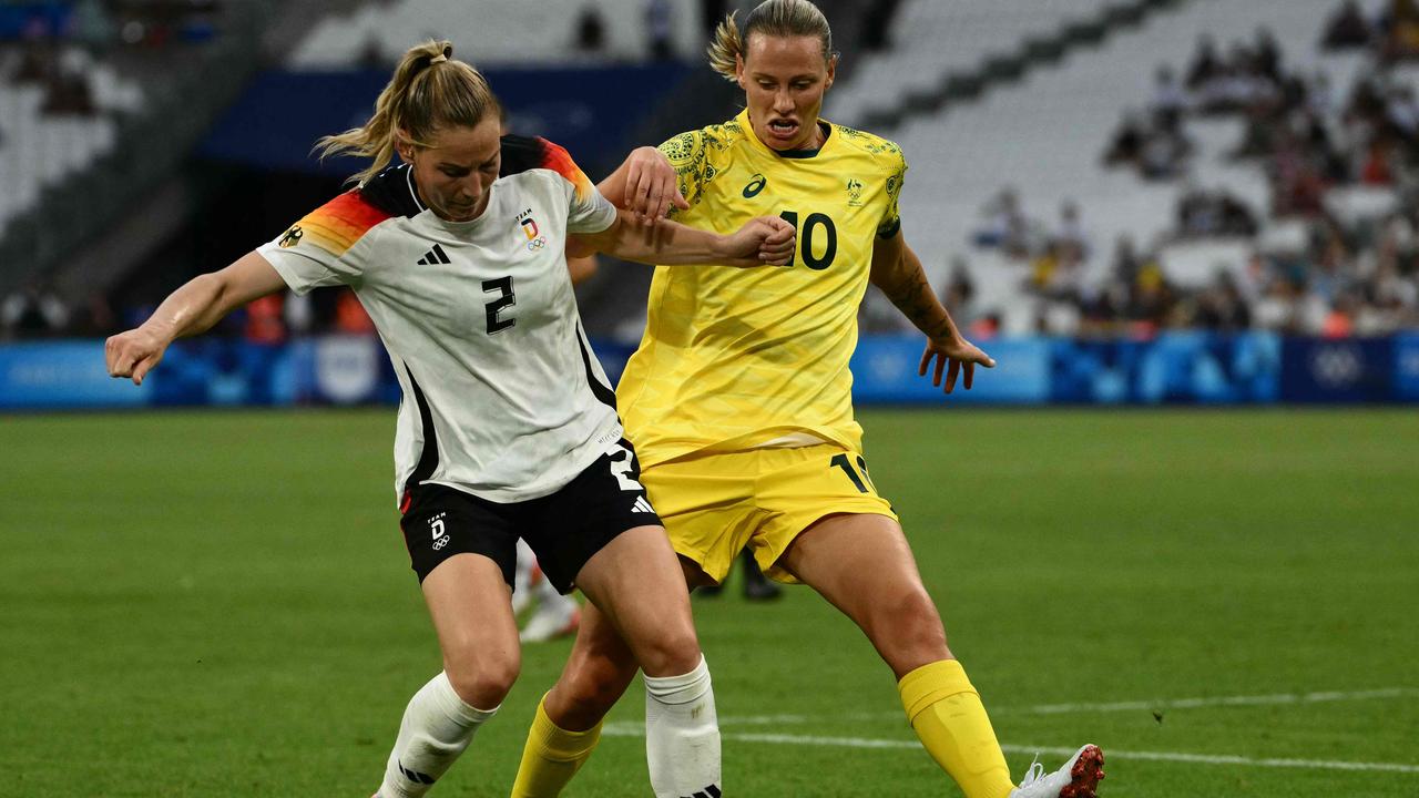 Germany's Sarai Linder is marked by Matildas midfielder Emily van Egmond during the Paris 2024 Olympic Games. Picture: AFP