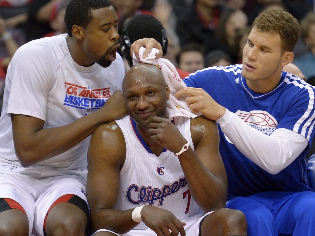 Los Angeles Clippers center DeAndre Jordan, and forward Blake Griffin, playfully shine the head of forward Lamar Odom as they sit on the bench during the second half of their NBA basketball game against the Golden State Warriors, on January 5, 2013 in Los Angeles. Picture: AAP