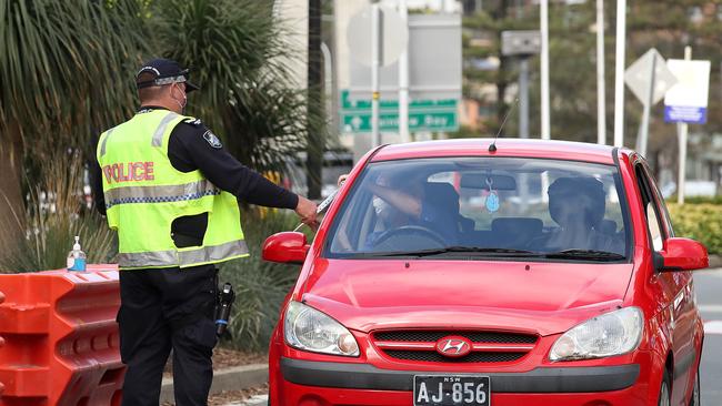 Police work at a checkpoint at the Queensland and NSW border in September. Picture: NCA NewsWire / Jono Searle