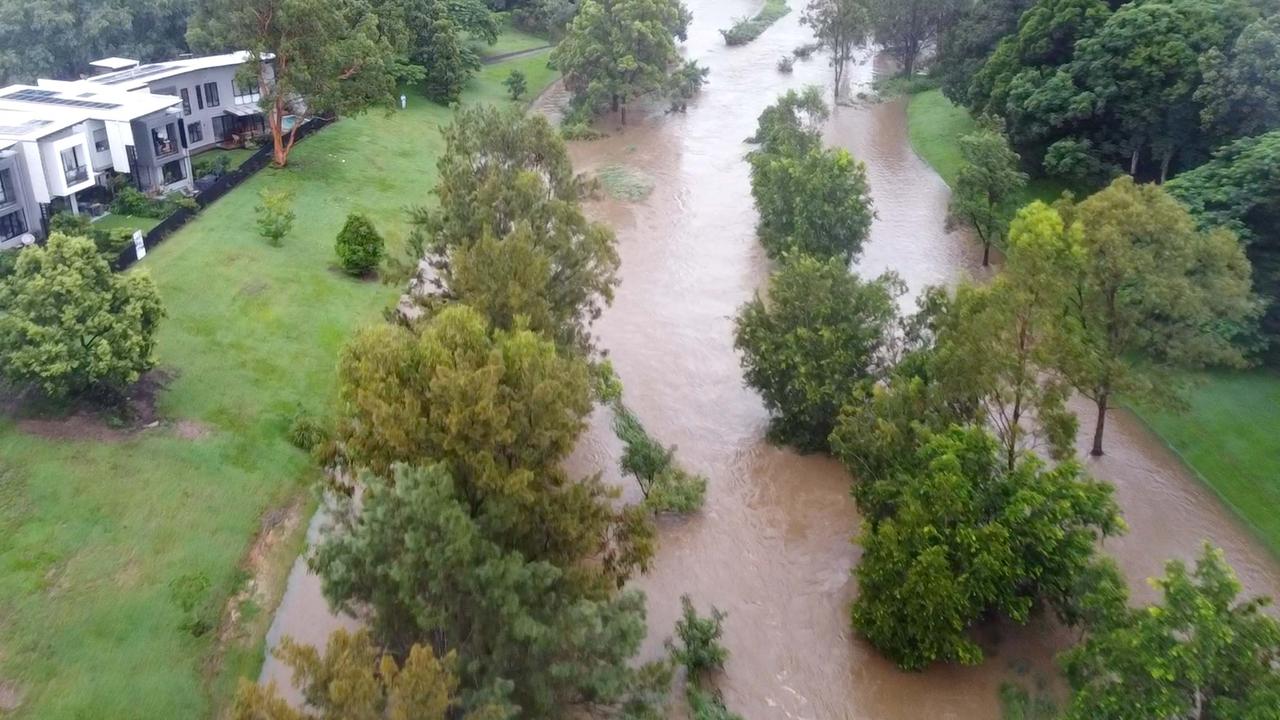 Kedron Brook in flood near Hickey Park. Picture: Sean Callinan