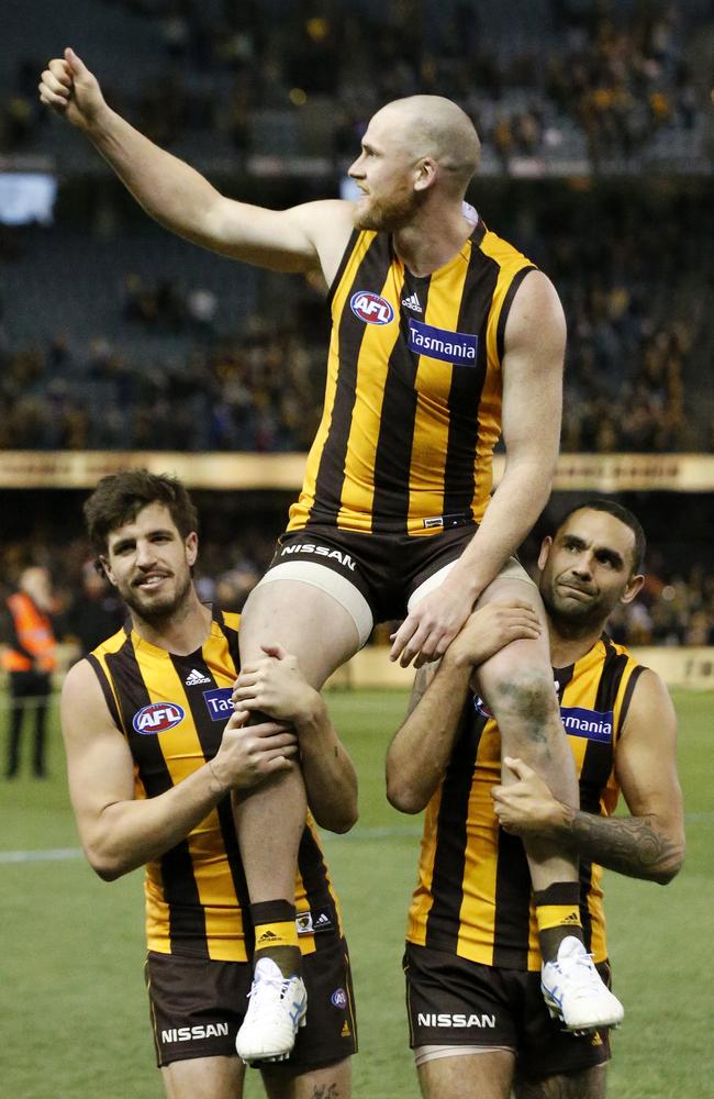 Jarryd Roughead of the Hawks is chaired off