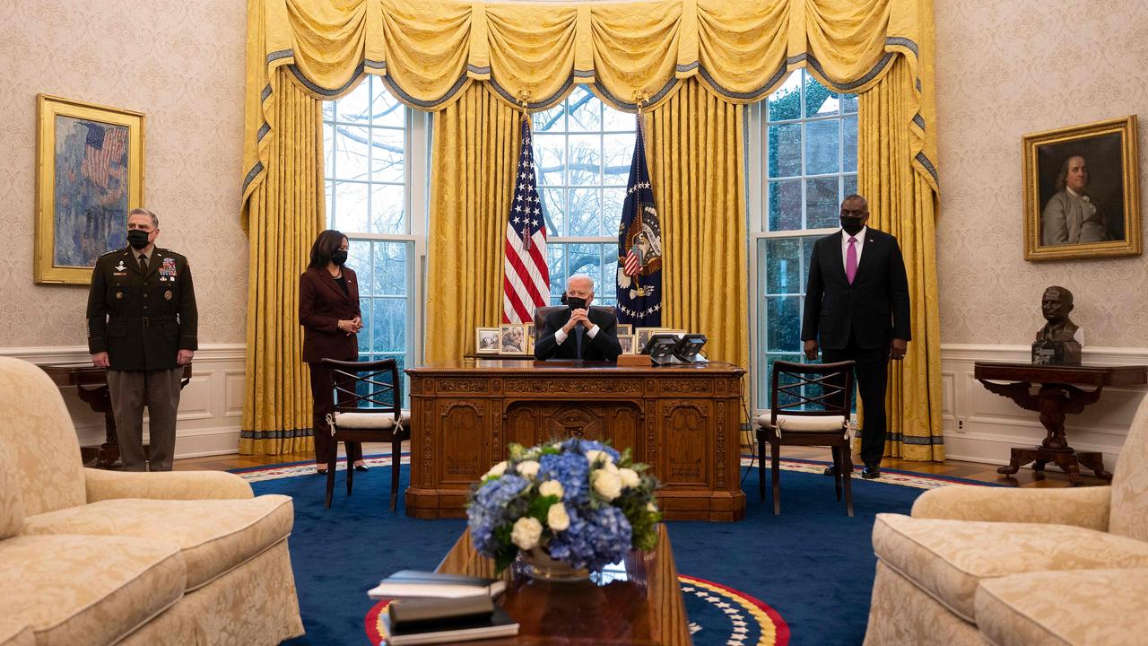 Chairman of the Joint Chiefs Mark Milley, Vice President Kamala Harris, President Joe Biden and Defence Secretary Lloyd Austin today. Picture: Jim Watson/AFP