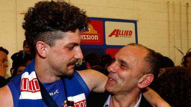 Tom Liberatore shares a beer with his dad Tony Liberatore. (Photo by Adam Trafford/AFL Media/Getty Images)