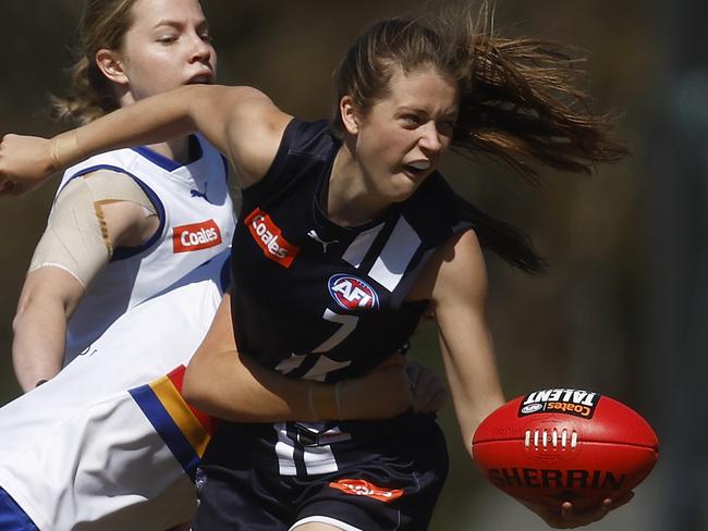 MELBOURNE, AUSTRALIA - SEPTEMBER 16: Sara Howley of the Falcons handballs whilst being tackled by Evie Parker of the Ranges during the Coates Talent League Girls Preliminary Final match between Eastern Ranges and Geelong Falcons at Shepley Oval on September 16, 2023 in Melbourne, Australia. (Photo by Daniel Pockett/AFL Photos/via Getty Images)