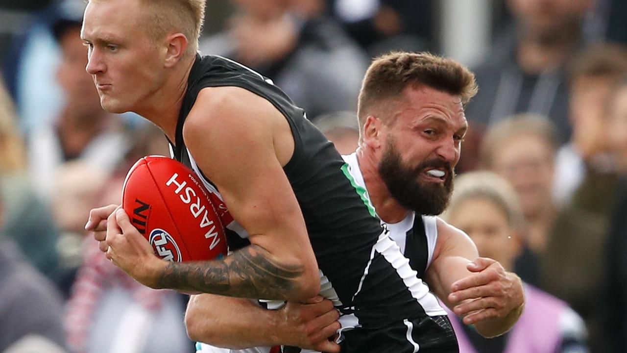 Jarryn Geary tackles Magpies forward Jaidyn Stephenson. Picture: AFL Photos