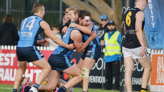 Josh Patullo, <ld pattern="."/>– stitched up after a head knock – celebrates a goal in Sturt’s win over Glenelg. Picture: AAP/Brenton Edwards