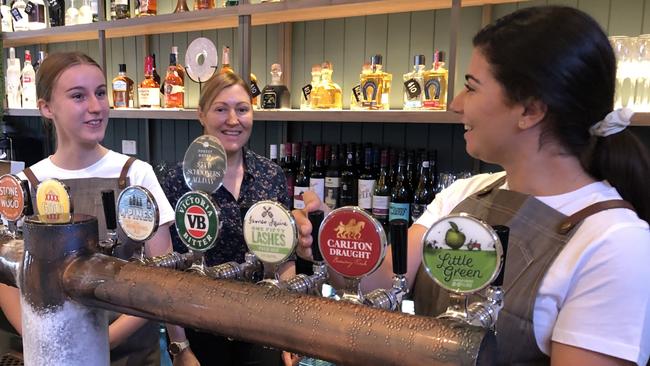 Licensee Deb Haskins (centre) with some last minute instructions to bar and bistro staff Maddie Clacy (left), of Belrose, and Anna Silva, (right) of Belrose, at the Forest Hotel at Frenchs Forest just before it opened its doors on Friday morning. Picture: Jim O'Rourke