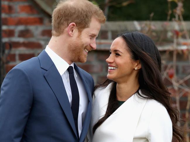 LONDON, ENGLAND - NOVEMBER 27:  Prince Harry and Meghan Markle during an official photocall to announce the engagement of Prince Harry and actress Meghan Markle at The Sunken Gardens at Kensington Palace on November 27, 2017 in London, England.  Prince Harry and Meghan Markle have been a couple officially since November 2016 and are due to marry in Spring 2018.  (Photo by Chris Jackson/Getty Images)