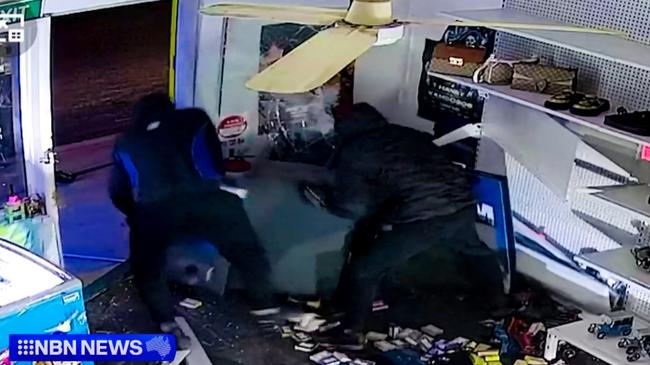 The thieves used a chain on the back of a stolen ute to rip the ATM from its footings before dragging it outside. Picture: NBN News.