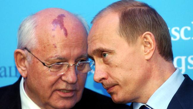 Ex-Soviet president Mikhail Gorbachev with Vladimir Putin in 2004. Picture: Getty Images