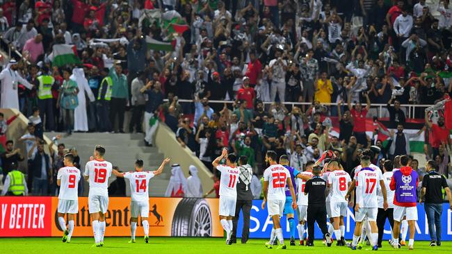 Palestine players greet their fans after their draw with Syria. Picture: AFP