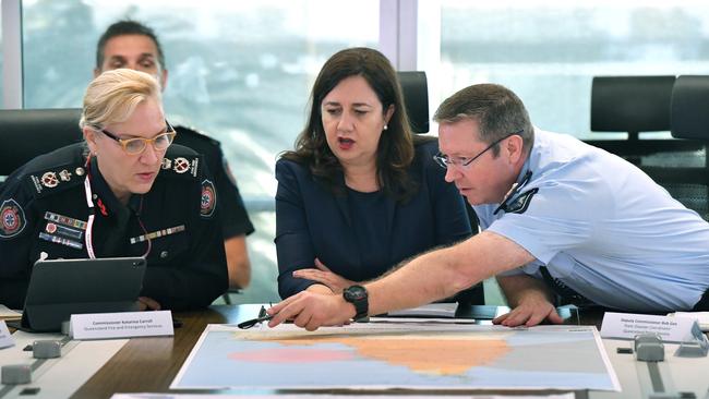 QFES Commissioner, Katarina Carroll (left), Premier Annastacia Palaszczuk and Queensland Police Deputy Commissioner Bob Gee during a meeting to plan the response to Tropical Cyclone Trevor in March. Picture: AAP Image/Darren England