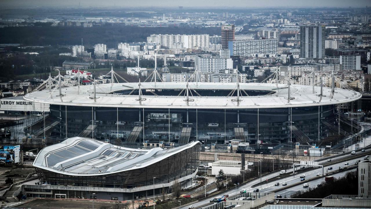 The Aquatic Olympic Center (CAO) swimming pool, and the 'Stade de France' stadium from the Pleyel Tower. Photo by STEPHANE DE SAKUTIN / AFP.