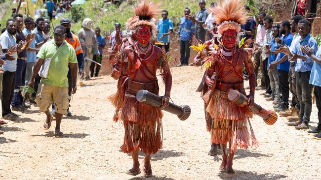 Villagers in Primaga celebrate the opening of a microgrid developed by the Santos Foundation, DFAT and SLB. Picture: Santos