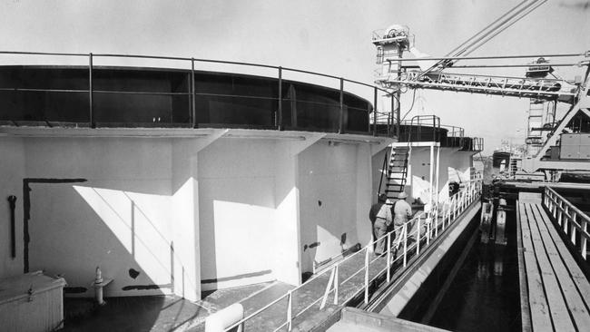 A Adelaide Brighton carrier unloads limestone at the Birkenhead wharves in Adelaide.