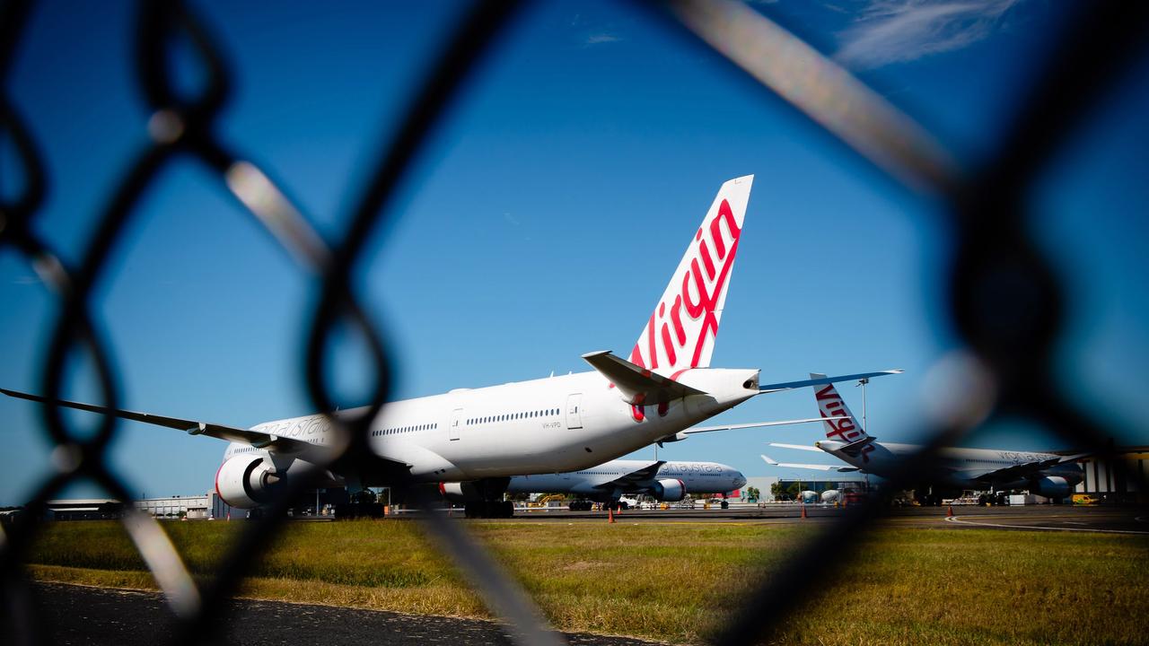 Virgin Australia aircraft parked on the tarmac at Brisbane Airport. Picture: Patrick Hamilton/AFP