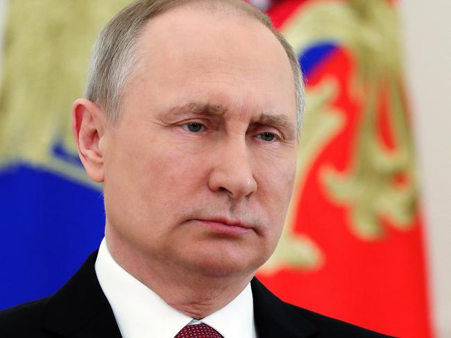 Russian President Vladimir Putin speaks during a live televised speech in Moscow, Russia, Friday, March 23, 2018. Russian electoral officials have officially declared incumbent President Vladimir Putin the winner of last Sunday's election. The Central Election Commission on Friday issued final results, showing that Putin won nearly 77 percent of the vote. Communist candidate Pavel Grudinin came second with nearly 12 percent. (Mikhail Klimentyev, Sputnik, Kremlin Pool Photo via AP)