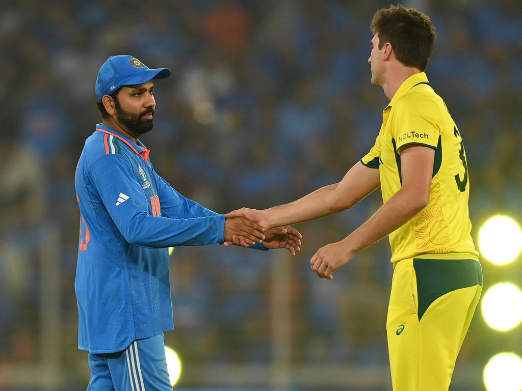 India captain Rohit Sharma shakes hands with Australia captain Pat Cummins after the visitors broke a billion hearts by denying the hosts in the decider. Picture: Gareth Copley/Getty Images