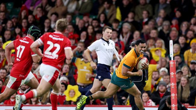 Len Ikitau scores the Wallabies’ seventh try in Cardiff. Picture: Michael Steele/Getty Images