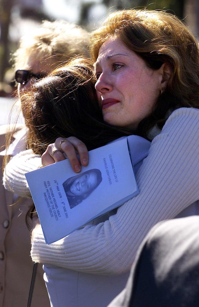 Friends comfort each other at the funeral of Rachelle Childs, 23, whose burnt body was found at Gerroa by security guard investigating scrub fire. Picture: Troy Bendeich