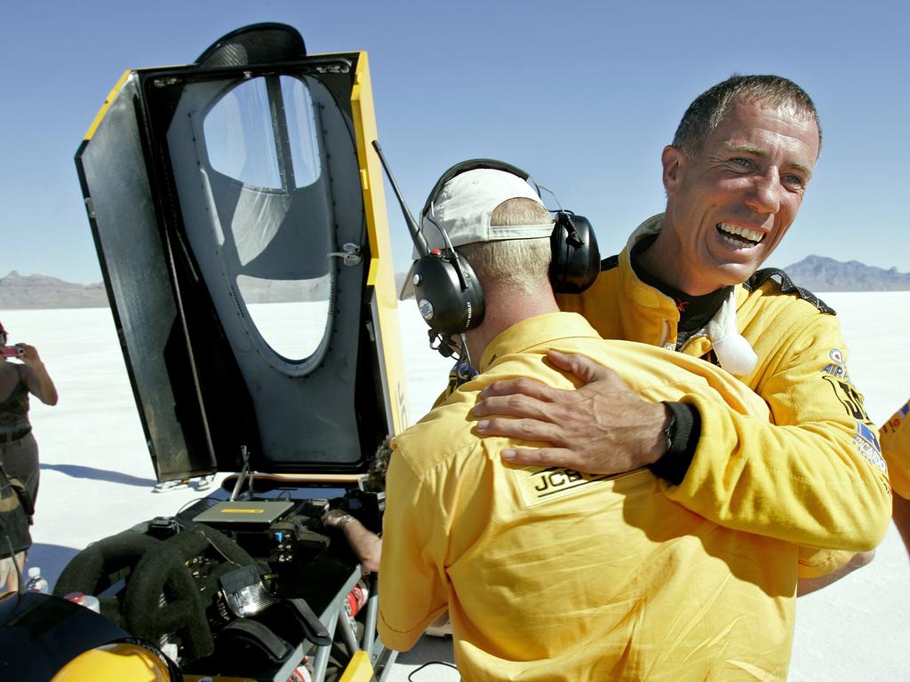 British pilot Andy Green hugging a crew member after breaking 1973 land-speed record.