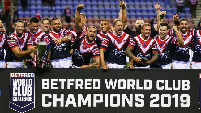 WIGAN, ENGLAND - FEBRUARY 17: Sydney Roosters players celebrate victory with the trophy after the World Club Challenge match between Wigan Warriors and Sydney Roosters at DW Stadium on February 17, 2019 in Wigan, England. (Photo by Alex Livesey/Getty Images)