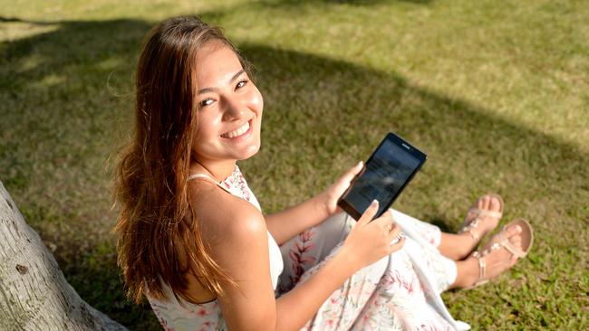 The Samsung Galaxy Tab A 8.0 features a lightweight sleek metal design, perfect for reading on the go. Jade Eggins, 14, tries it out. Picture: Alix Sweeney