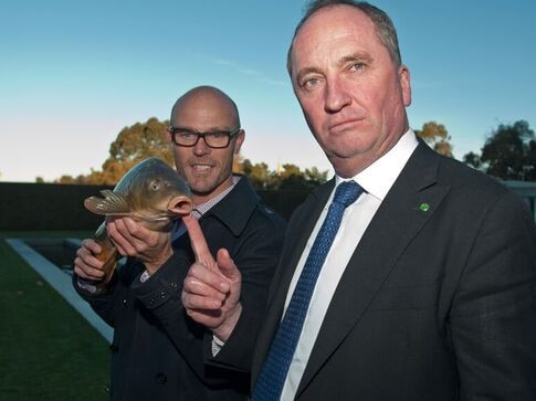 Former deputy prime minister and water minister Barnaby Joyce with ‘Carpinator’ Matt Barwick, and a European carp.