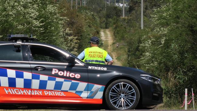 A Highway Patrol car blocks Virginia Rd Fire Trail at Hamlyn Terrace where an alleged stolen car was tracked to following a police pursuit before it was set alight. Picture: Richard Noone