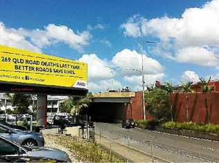 SIGN LANGUAGE: An RACQ billboard on road safety appears on the Bruce Highway demanding action from the major political parties on urgent road funding. Picture: DARREN CARTWRIGHTAAP